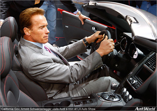 California Gov. Arnold Schwarzenegger visits Audi e-tron at the Los Angeles Auto Show to see the future of electric mobility