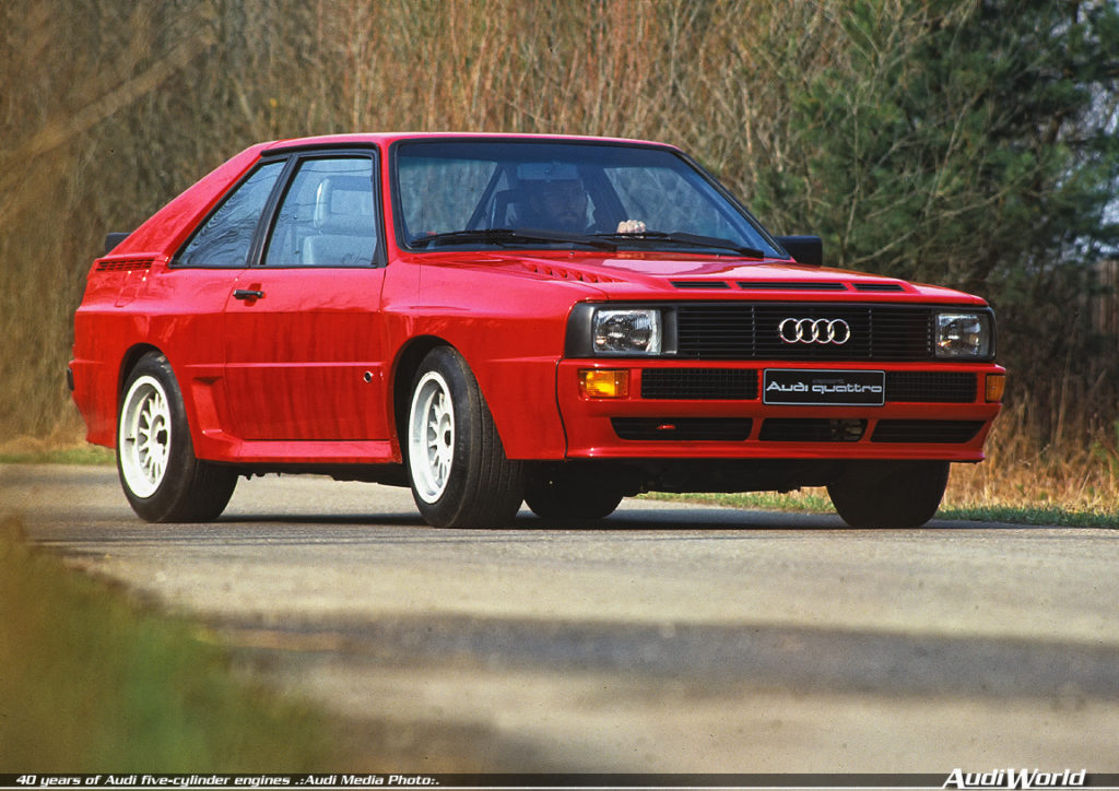 1983: five-cylinder gasoline engine with four-valve technology, turbocharger and intercooler: In September 1983, Audi presents the Audi Sport quattro (B2) at the International Motor Show in Frankfurt am Main. It is powered by a 2.1-liter highperformance engine with four-valve technology that produces 225 kW (306 hp) at 6,700 revolutions per minute. The maximum torque of 350 newton meters (258.15 lb-ft) is available at 3,700 rpm. Delivery commences in May 1984. The Audi Sport quattro (B2) is a special series limited to 214 vehicles, produced to meet homologation requirements for rallying. The rules stipulate that displacement must be limited to a maximum of 2,133 cc.