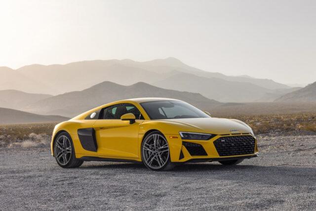 Yellow 2023 Audi R8 Coupe parked on gravel road
